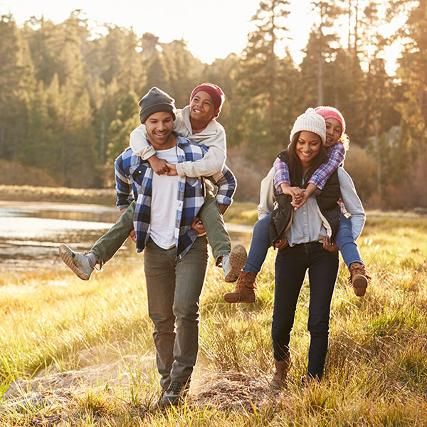 FamilyofFourHiking Family of Four hiking by a river