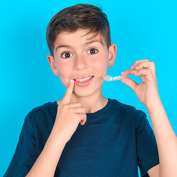 OrthodonticEmergencies Child holding orthodontic appliances